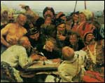 Группа людей в исторических костюмах собралась вокруг стола, где один человек пишет или рисует, другие наблюдают; сцена напоминает историческое или бытовое событие.